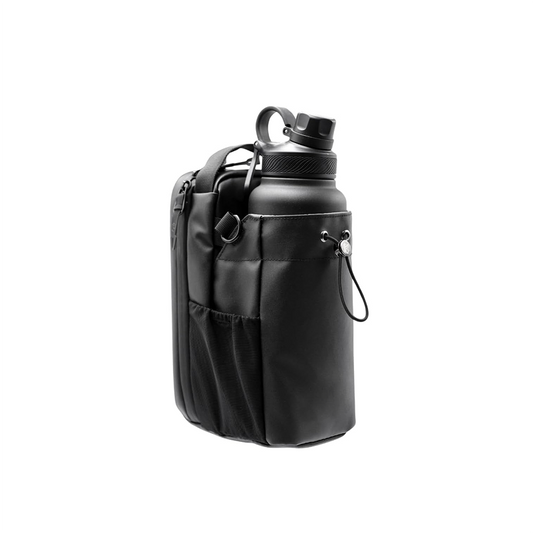 A black magnetic gym bag with multiple compartments and a water bottle attached to it.