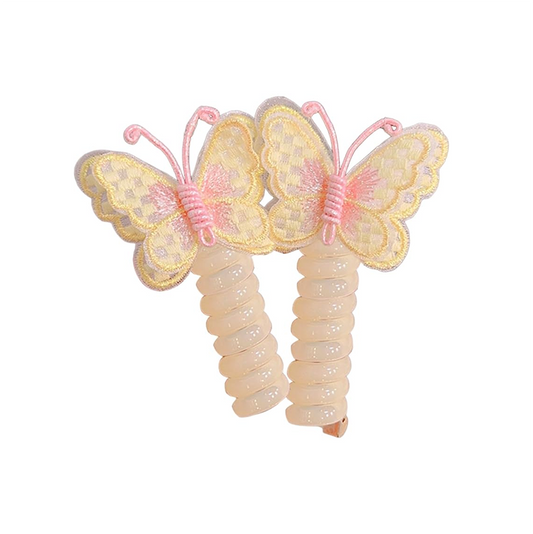 Two pink and yellow butterfly charm hair ties on a white background